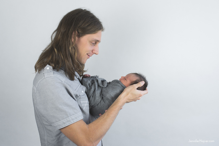 new father holding baby boy